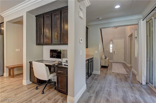 5635 Mesa Mountain Dr, Las Vegas, NV 89135 - home office with light wood-style floors, built in desk, ornamental molding, baseboards, and recessed lighting