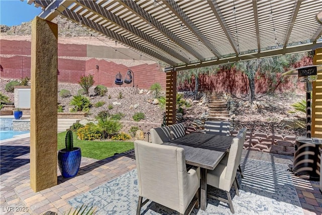 5635 Mesa Mountain Dr, Las Vegas, NV 89135 - view of patio / terrace featuring a pergola, outdoor dining area, and an outdoor pool