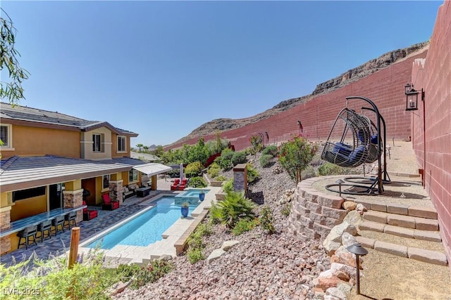 5635 Mesa Mountain Dr, Las Vegas, NV 89135 - view of pool with a patio area, a mountain view, a fenced backyard, and outdoor lounge area