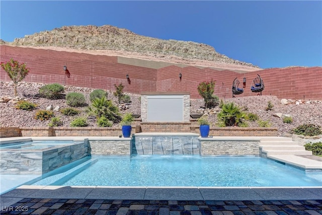 5635 Mesa Mountain Dr, Las Vegas, NV 89135 - view of swimming pool featuring a pool with connected hot tub