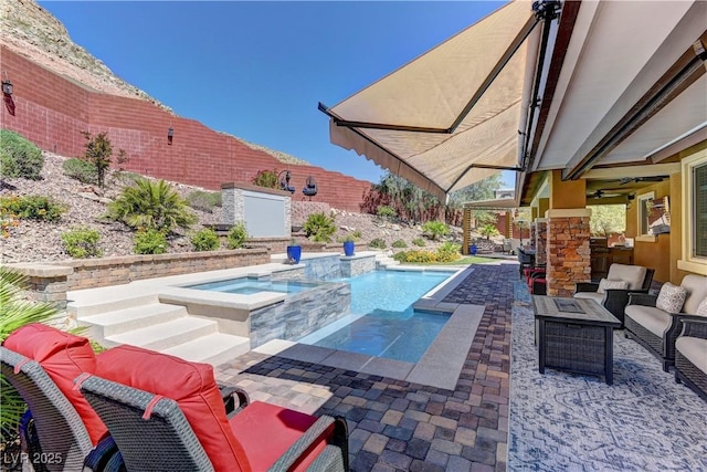5635 Mesa Mountain Dr, Las Vegas, NV 89135 - view of pool featuring an outdoor hangout area, a patio area, a fenced backyard, and a pool with connected hot tub