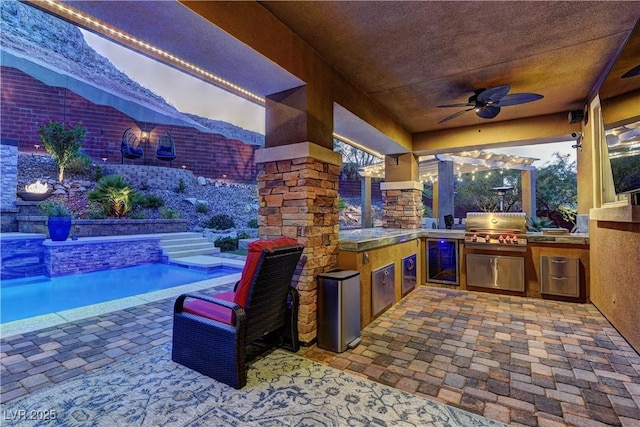 5635 Mesa Mountain Dr, Las Vegas, NV 89135 - view of patio with ceiling fan, beverage cooler, and an outdoor pool