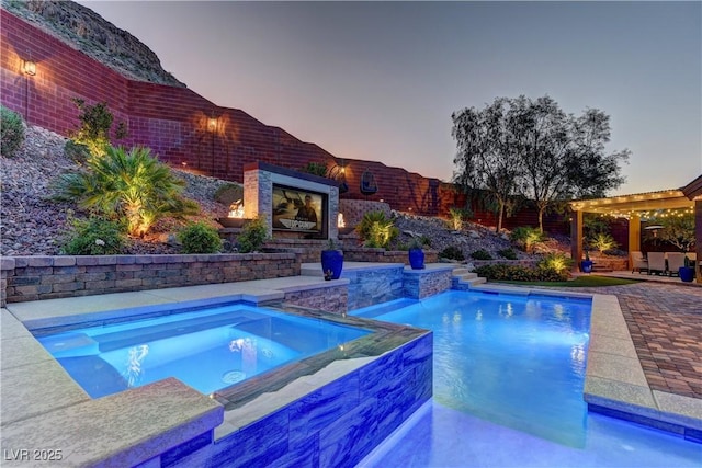 5635 Mesa Mountain Dr, Las Vegas, NV 89135 - swimming pool featuring an in-ground hot tub, an outdoor fireplace, a patio, and a pergola