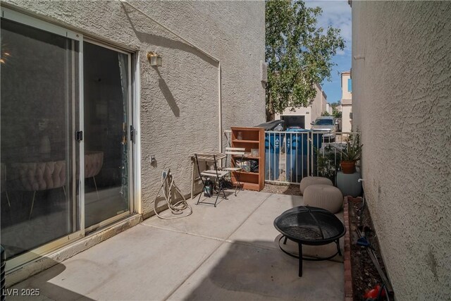 10049 Fragile Fields St, Las Vegas, NV 89183 - view of patio / terrace featuring a fire pit