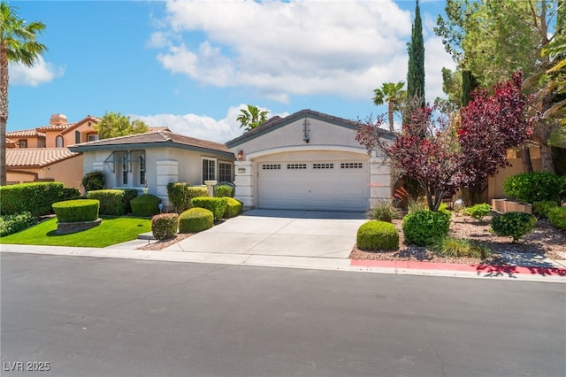11405 Perugino Dr, Las Vegas, NV 89138 - view of front of house with driveway, an attached garage, and stucco siding