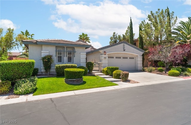 11405 Perugino Dr, Las Vegas, NV 89138 - view of front facade featuring driveway, a garage, a front yard, stucco siding, and a gate