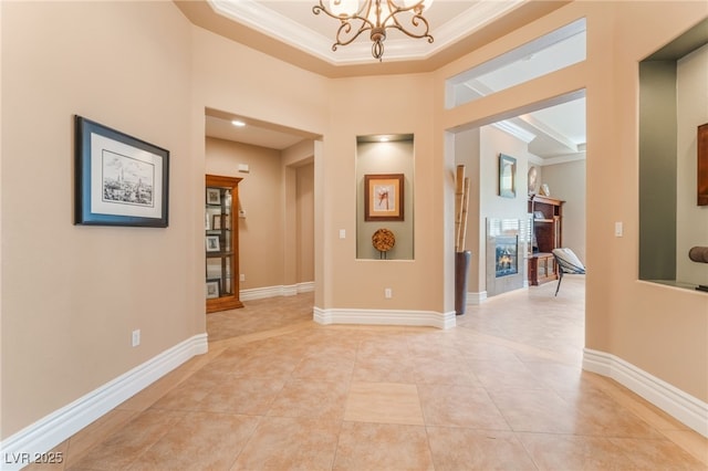 11405 Perugino Dr, Las Vegas, NV 89138 - hallway with ornamental molding, a chandelier, light tile patterned floors, and baseboards