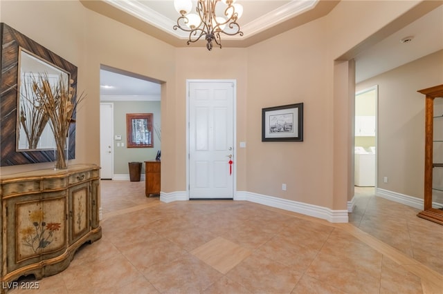 11405 Perugino Dr, Las Vegas, NV 89138 - entrance foyer with crown molding, a chandelier, light tile patterned floors, a raised ceiling, and baseboards
