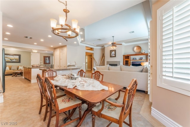 11405 Perugino Dr, Las Vegas, NV 89138 - dining space with a fireplace, ceiling fan, recessed lighting, a chandelier, and baseboards