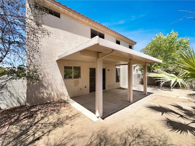 7900 Wood Shadow Ct, Las Vegas, NV 89131 - rear view of property with stucco siding, a patio area, and a tiled roof