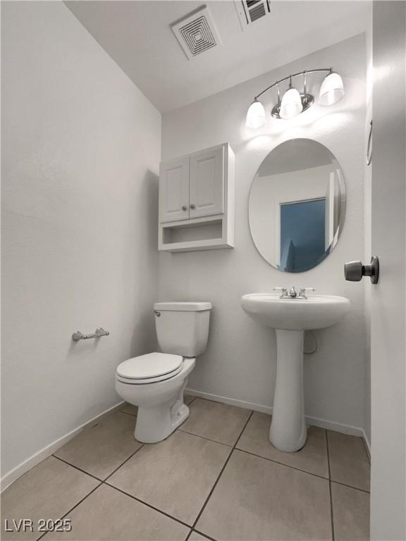 7900 Wood Shadow Ct, Las Vegas, NV 89131 - bathroom featuring toilet, tile patterned flooring, and baseboards