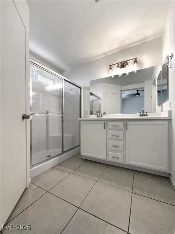 7900 Wood Shadow Ct, Las Vegas, NV 89131 - full bath featuring a shower stall, tile patterned flooring, and double vanity