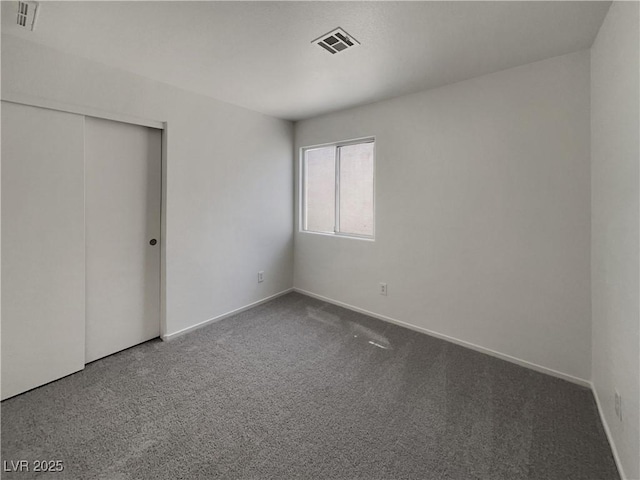 7900 Wood Shadow Ct, Las Vegas, NV 89131 - unfurnished bedroom with carpet flooring, a closet, and baseboards
