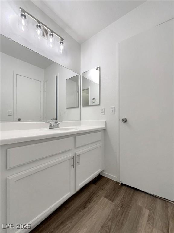 7900 Wood Shadow Ct, Las Vegas, NV 89131 - bathroom with wood finished floors, vanity, and baseboards
