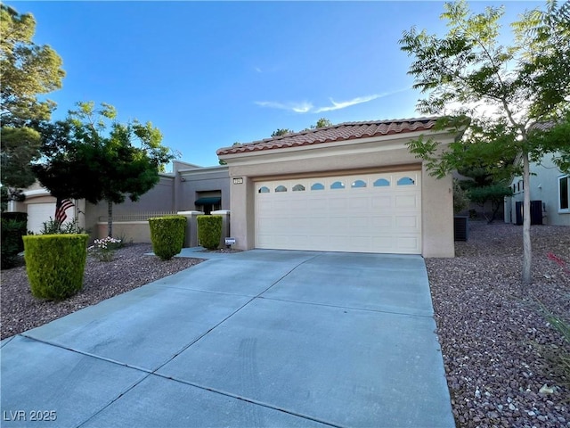 2343 Scotch Lake St, Las Vegas, NV 89134 - mediterranean / spanish home with stucco siding, driveway, a tiled roof, and a garage