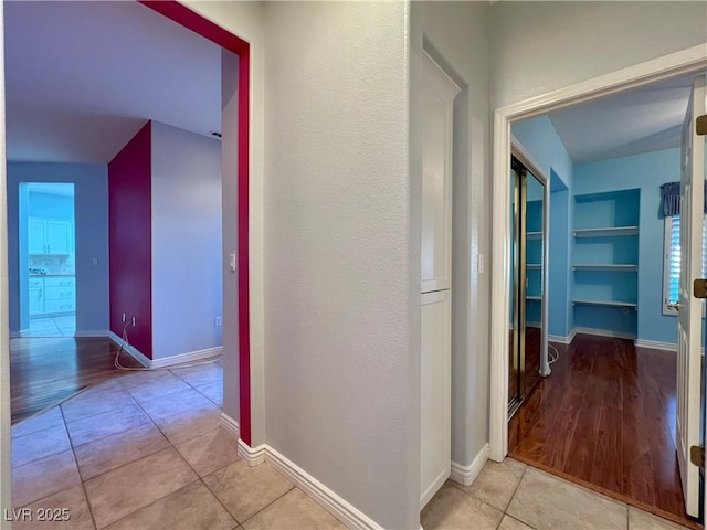2343 Scotch Lake St, Las Vegas, NV 89134 - hall with tile patterned floors, built in shelves, and baseboards