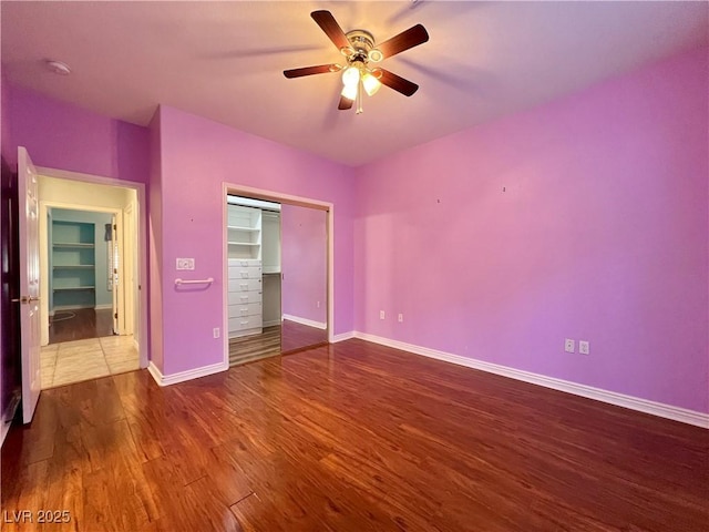 2343 Scotch Lake St, Las Vegas, NV 89134 - unfurnished bedroom featuring wood finished floors, a closet, baseboards, and ceiling fan