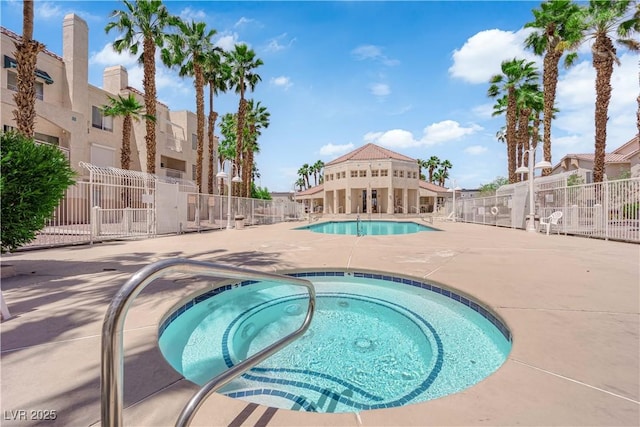 5000 Red Rock St Unit 259, Las Vegas, NV 89118 - community pool with a community hot tub, a patio, and a residential view