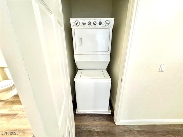 5250 S Rainbow Blvd Unit 2029, Las Vegas, NV 89118 - laundry room with stacked washer / dryer, baseboards, and wood finished floors