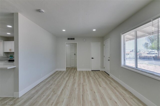 1825 Howard Ave, Las Vegas, NV 89104 - empty room with light wood-type flooring, baseboards, recessed lighting, and a smoke detector