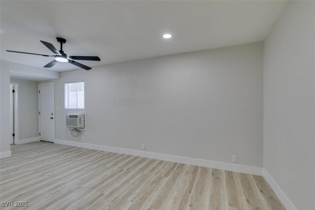 1825 Howard Ave, Las Vegas, NV 89104 - spare room featuring baseboards, light wood finished floors, ceiling fan, a wall mounted air conditioner, and recessed lighting