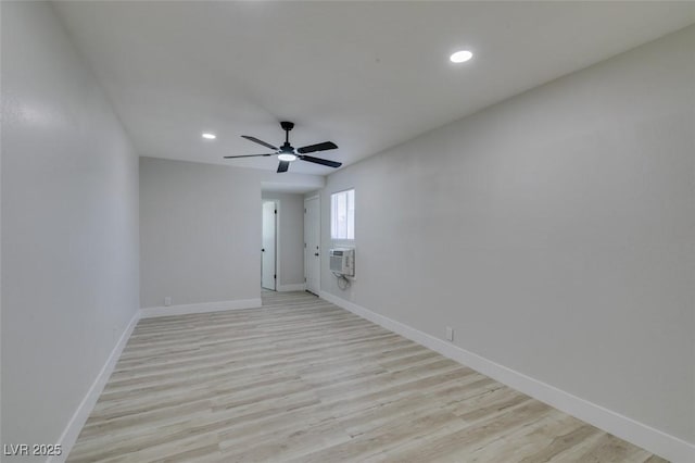 1825 Howard Ave, Las Vegas, NV 89104 - spare room with light wood-type flooring, baseboards, recessed lighting, a wall mounted air conditioner, and ceiling fan