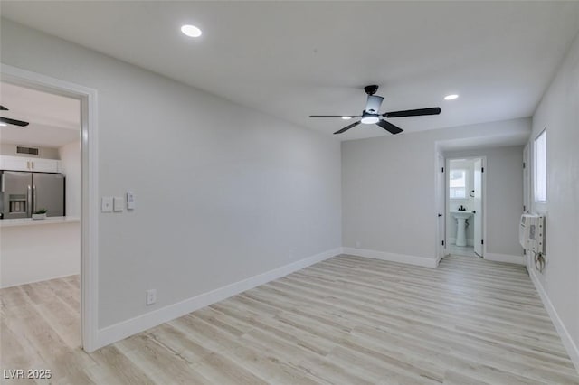1825 Howard Ave, Las Vegas, NV 89104 - unfurnished room featuring ceiling fan, light wood-style flooring, recessed lighting, baseboards, and a sink