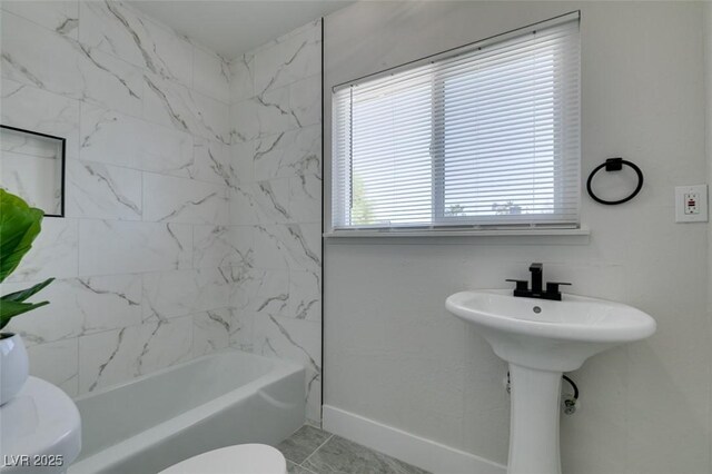 1825 Howard Ave, Las Vegas, NV 89104 - full bath featuring toilet, baseboards, and  shower combination