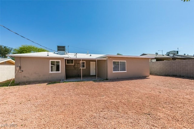 1825 Howard Ave, Las Vegas, NV 89104 - rear view of property featuring a patio, cooling unit, and stucco siding