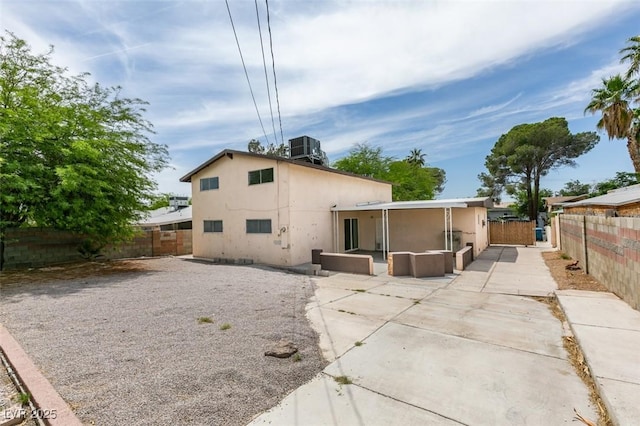 1806 Renada Cir, North Las Vegas, NV 89030 - rear view of property with a patio, a fenced backyard, stucco siding, and cooling unit