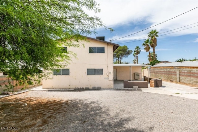 1806 Renada Cir, North Las Vegas, NV 89030 - rear view of house with a patio, a fenced backyard, and stucco siding