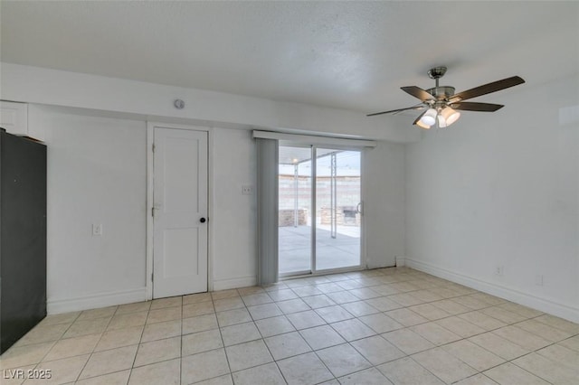1806 Renada Cir, North Las Vegas, NV 89030 - spare room featuring a ceiling fan, light tile patterned floors, and baseboards