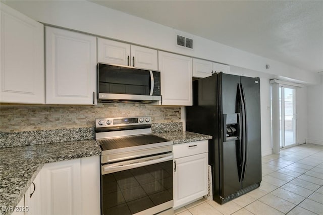 1806 Renada Cir, North Las Vegas, NV 89030 - kitchen with appliances with stainless steel finishes, tasteful backsplash, white cabinetry, and light tile patterned floors
