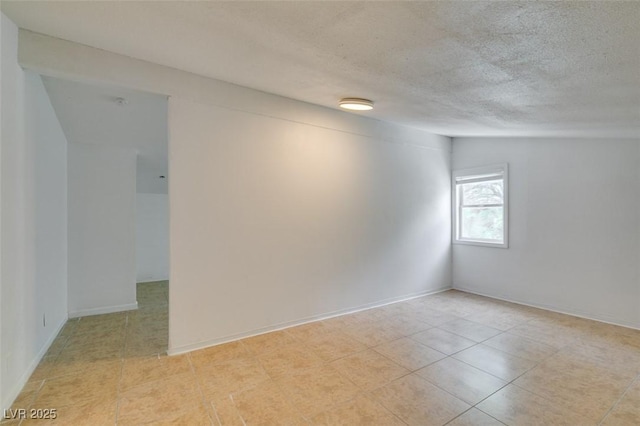 1806 Renada Cir, North Las Vegas, NV 89030 - unfurnished room with a textured ceiling and light tile patterned flooring