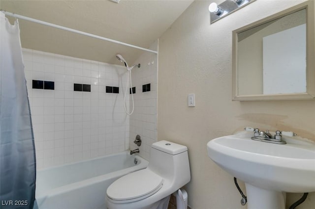 1806 Renada Cir, North Las Vegas, NV 89030 - full bathroom featuring shower / bath combo with shower curtain, toilet, a sink, and a textured wall