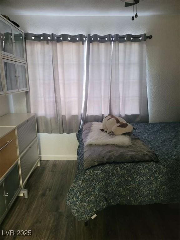 5335 Rod Ct Unit 102, Las Vegas, NV 89122 - bedroom with dark wood finished floors