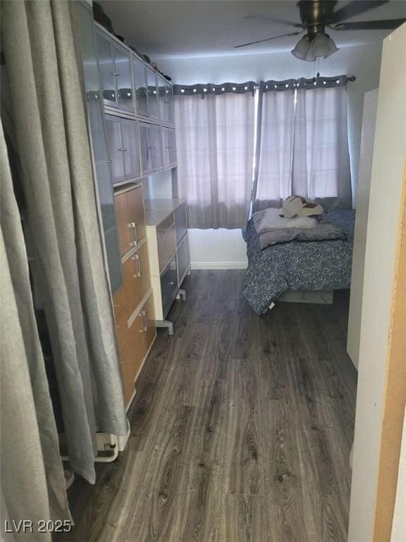 5335 Rod Ct Unit 102, Las Vegas, NV 89122 - bedroom with dark wood finished floors and a ceiling fan