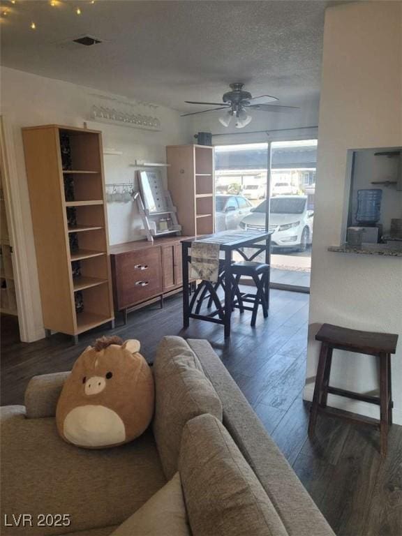 5335 Rod Ct Unit 102, Las Vegas, NV 89122 - living room with dark wood-type flooring and a ceiling fan