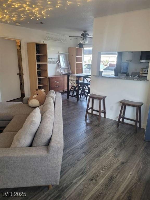 5335 Rod Ct Unit 102, Las Vegas, NV 89122 - living room with dark wood-type flooring and a ceiling fan