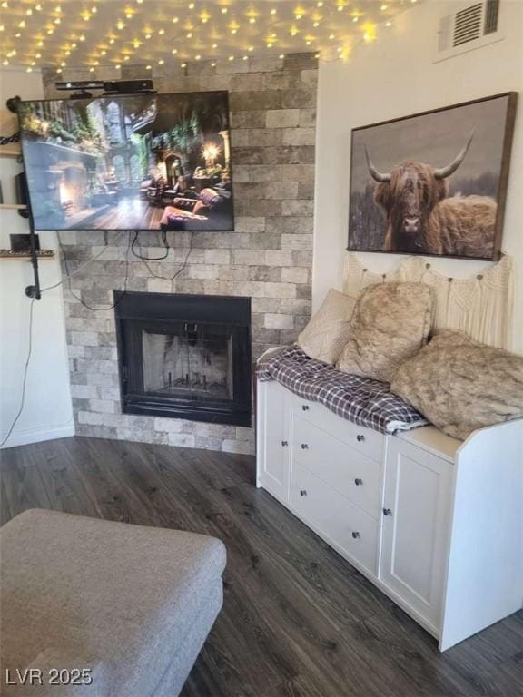 5335 Rod Ct Unit 102, Las Vegas, NV 89122 - living room with dark wood-type flooring and a fireplace