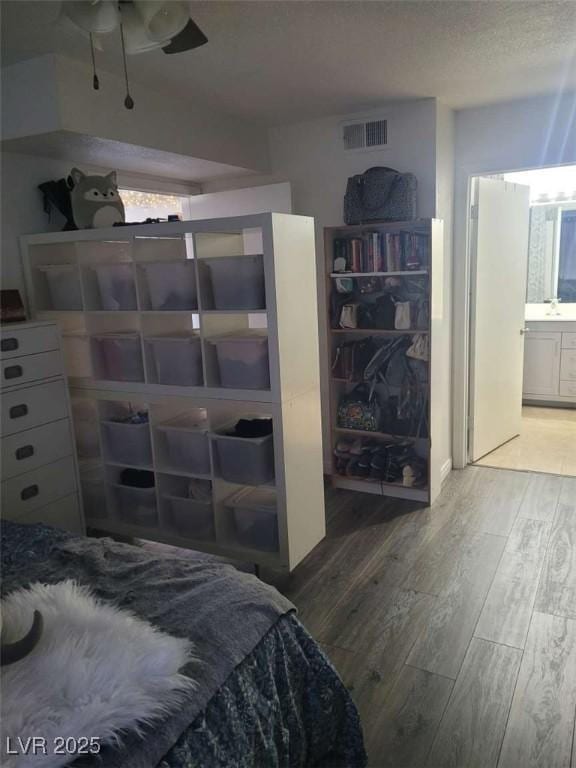 5335 Rod Ct Unit 102, Las Vegas, NV 89122 - bedroom with hardwood / wood-style flooring and ensuite bathroom