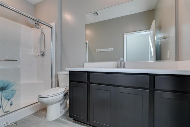 9239 Albus Hills Ave, Las Vegas, NV 89143 - bathroom with toilet, a stall shower, vanity, and wood finished floors