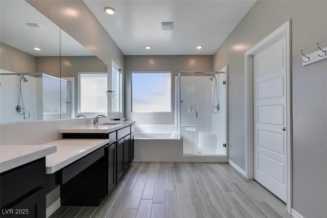 9239 Albus Hills Ave, Las Vegas, NV 89143 - bathroom with a stall shower, a bath, wood finished floors, and vanity