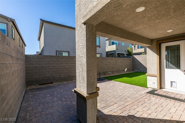 9239 Albus Hills Ave, Las Vegas, NV 89143 - fenced backyard with a patio area