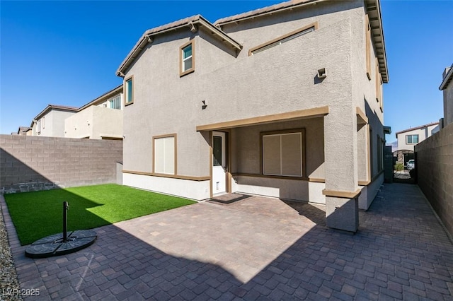 9239 Albus Hills Ave, Las Vegas, NV 89143 - back of property with a patio area, a fenced backyard, and stucco siding