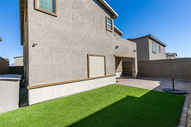 9239 Albus Hills Ave, Las Vegas, NV 89143 - back of property featuring stucco siding and a patio