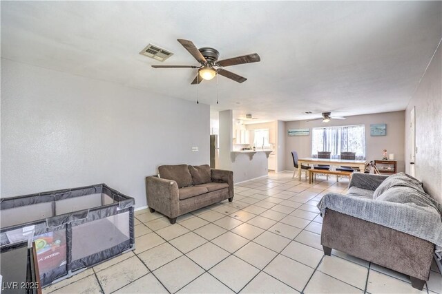844 Balzar Ave, Las Vegas, NV 89106 - living area featuring a ceiling fan, light tile patterned flooring, and baseboards