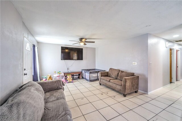 844 Balzar Ave, Las Vegas, NV 89106 - living area featuring light tile patterned floors, ceiling fan, and baseboards