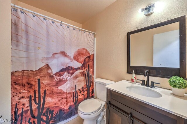 844 Balzar Ave, Las Vegas, NV 89106 - full bath with toilet, a textured wall, and vanity