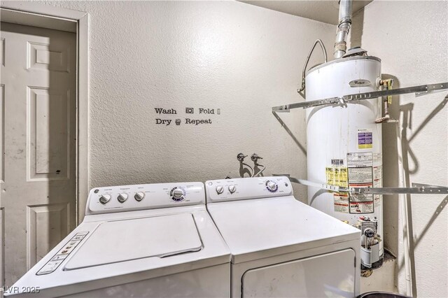 844 Balzar Ave, Las Vegas, NV 89106 - laundry area with secured water heater, separate washer and dryer, and a textured wall